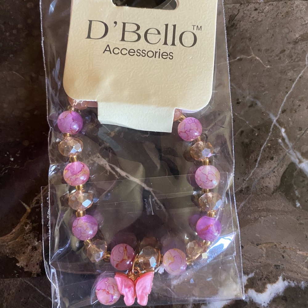 D’Bello Beaded pink bracelet with pink butterfly charm.